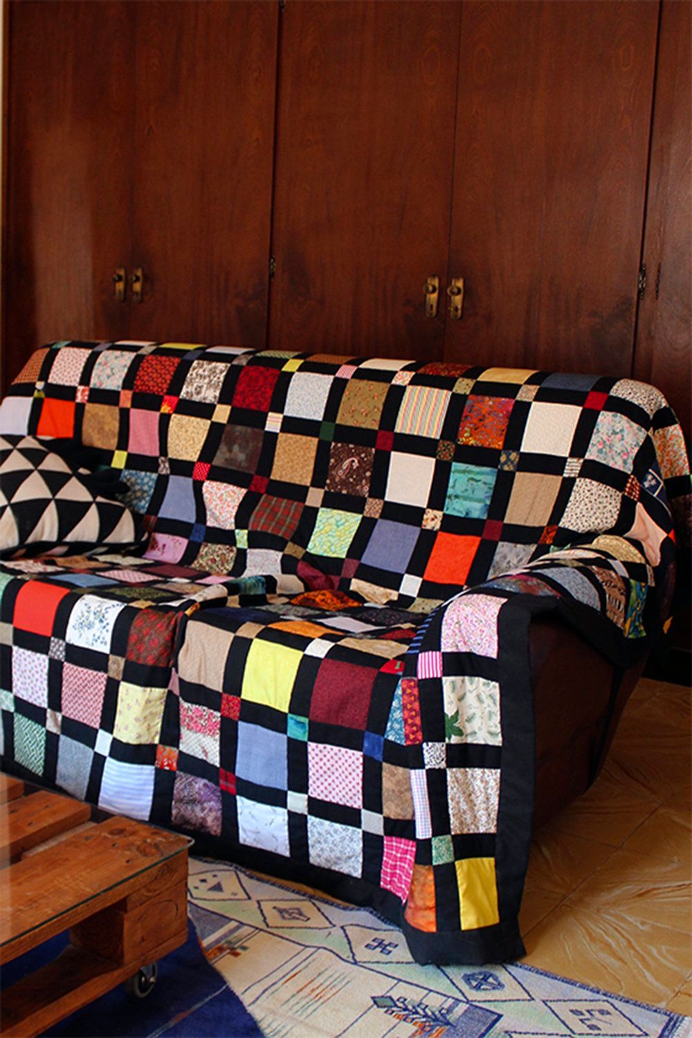 Patch quilt on sofa at Bussoga