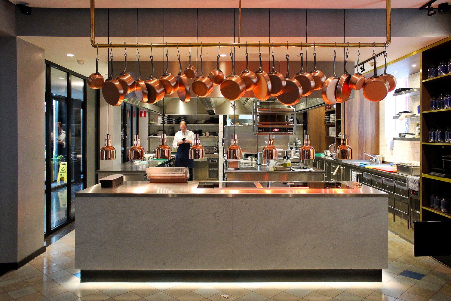 Concrete and copper open kitchen at the Pressroom Restaurant.
